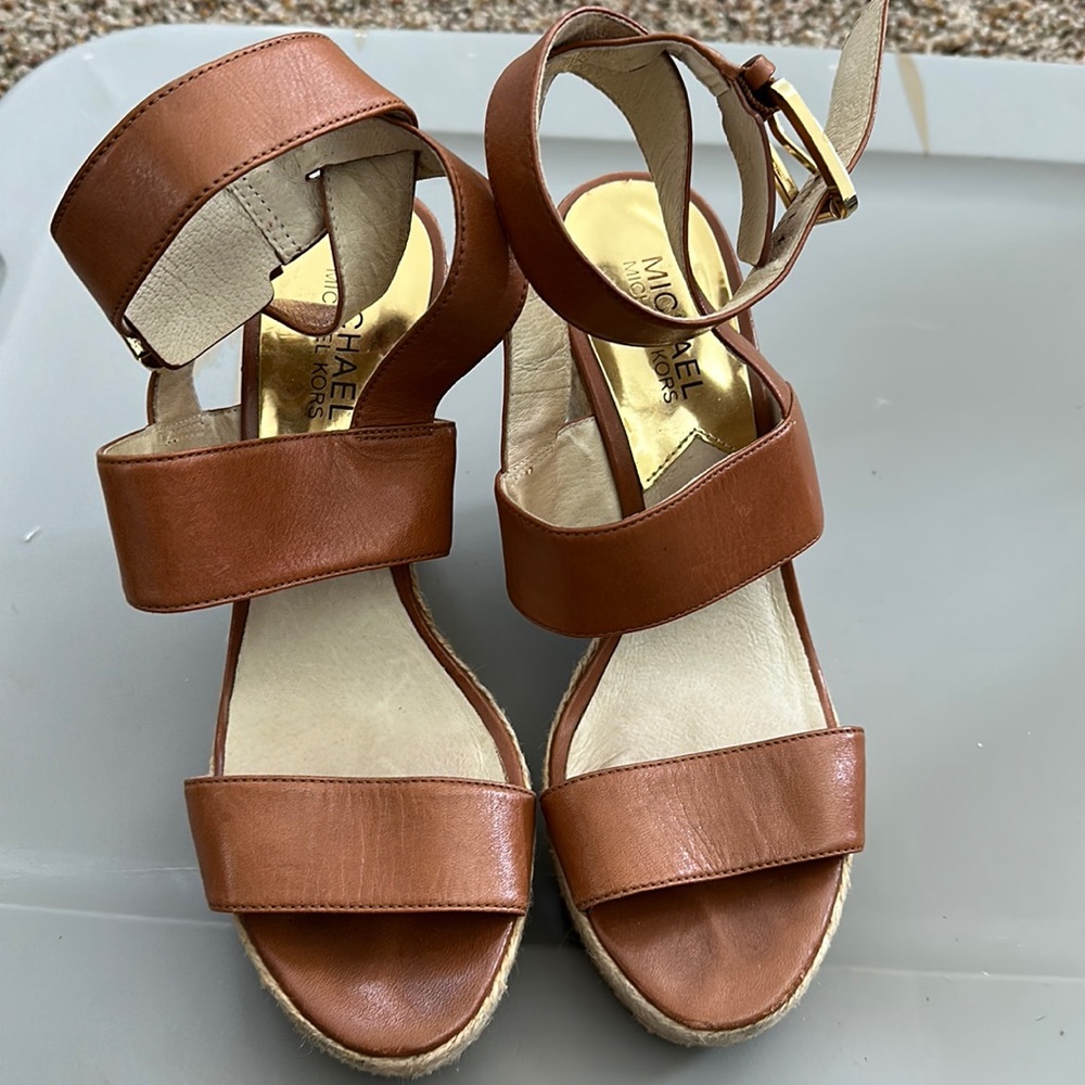 Michael Kors wedge sandal with ankle straps. Great shoe to dress up or down.